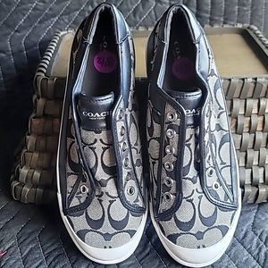 Slightly worn black coach sneakers